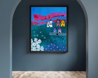 May include: A framed painting featuring a vibrant landscape with a bright blue sky, pink clouds, and a green field. The scene includes a white church, several colorful houses, a stone bridge, and clusters of white and purple flowers in the foreground.