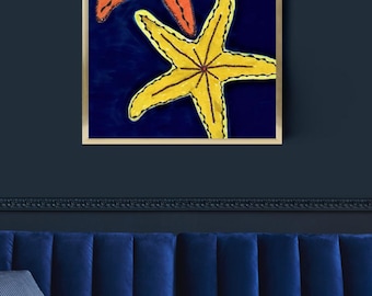 May include: A framed wall art print featuring a deep navy blue background with two starfish illustrations. One starfish is bright orange and positioned in the upper left, while the second starfish is vibrant yellow and located in the lower right.