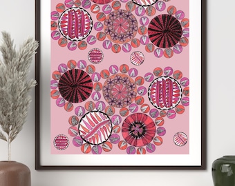 May include: A framed wall art print featuring a repeating pattern of circular motifs on a light pink background. The circles contain intricate black and red ink drawings of floral, geometric, and striped designs, surrounded by smaller pink dots.