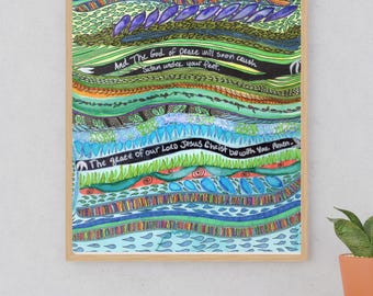 May include: A framed vertical art print featuring colorful, layered horizontal bands of abstract patterns in shades of blue, green, orange, and purple. The text reads Romans 16:20, And The God of peace will soon crush Satan under your feet, and The grace of our Lord Jesus Christ be with You. Amen.