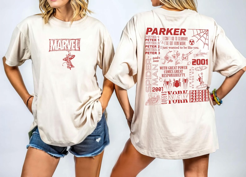 May include: Beige t-shirt featuring a red Marvel logo and Spider-Man graphic on the front. The back displays a Spider-Man design with text including "Parker", "Spider-Man", "2001", and "New York".