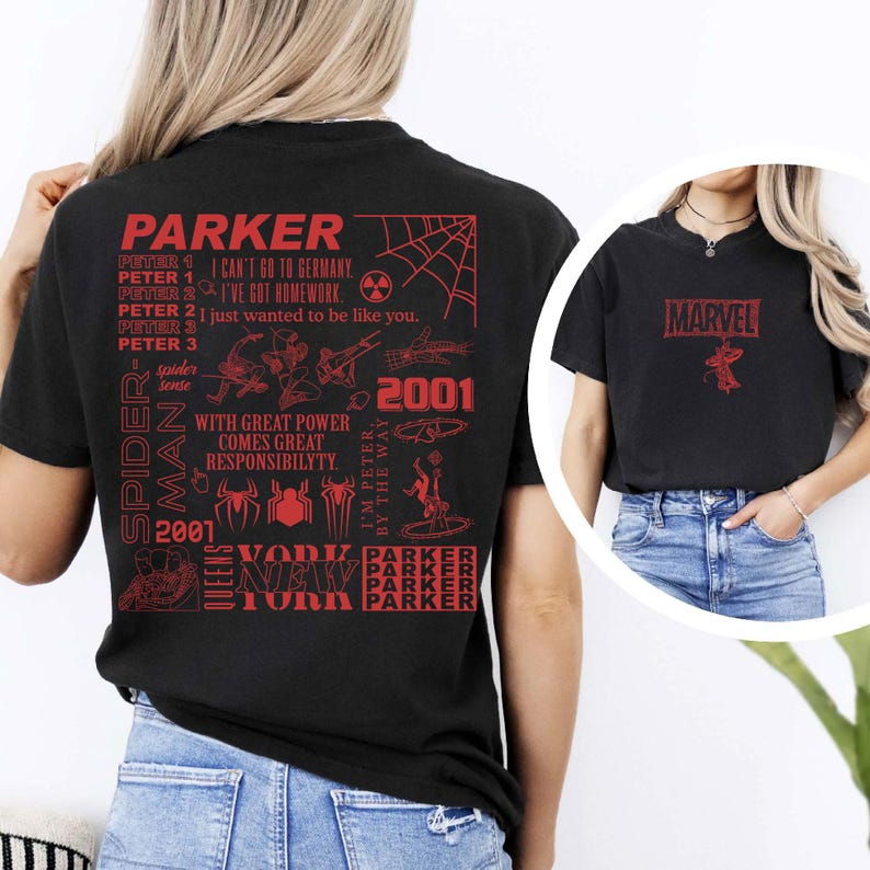 May include: Black t-shirt with red graphic text and illustrations. The back of the shirt features the name "PARKER" and text about Peter Parker. The front of the shirt has the word "MARVEL" and a spider graphic.