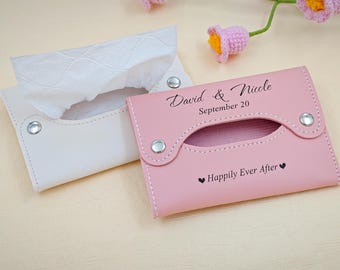May include: Two tissue box covers, one white and one pink, with silver snap closures. The pink cover has the text "David & Nicole September 20" and "Happily Ever After". The white cover holds white tissues.