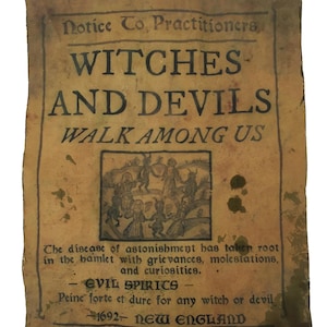 May include: Aged paper with the text "Witches and Devils Walk Among Us" in dark ink. The paper has a distressed look with stains and a small illustration of figures. The text includes the year 1692 and the words "New England".