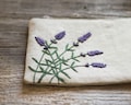 Hand-Embroidered Lavender Zipper Pouch, Linen and Cotton Cosmetic Bag, Lavandula angustifolia Embroidery product logo