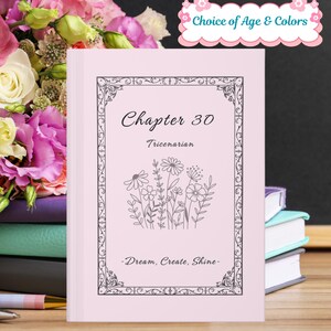 May include: A pink book with the text "Chapter 30 Tricenarian" and a floral illustration. The book has a decorative border and the words "Dream, Create, Shine" at the bottom. The top right corner has the text "Choice of Age & Colors".