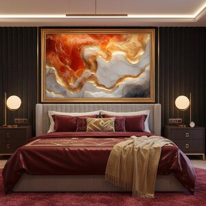 May include: A luxurious bedroom featuring a large bed with burgundy bedding, a gold-framed abstract painting, and a plush, round, burgundy rug. Two bedside tables with lamps flank the bed.