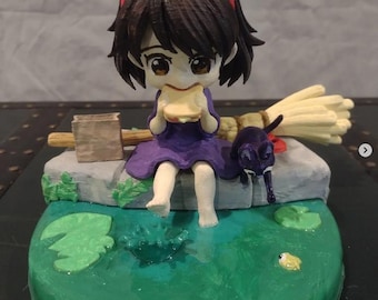 Handgemaakte figuur van Kiki en Jiji Kiki's bezorgservice