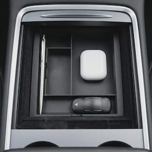 May include: A handmade, wooden cutting board with a natural finish. The board features a live edge and a juice groove. Dimensions are approximately 18 inches long, 12 inches wide, and 1 inch thick.