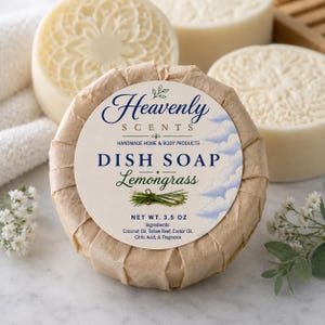 May include: A round bar of dish soap wrapped in brown paper with a label reading Heavenly Scents, Dish Soap, Lemongrass, Net Wt. 3.5 oz, and a list of ingredients. The soap features a circular embossed floral pattern on the top surface.