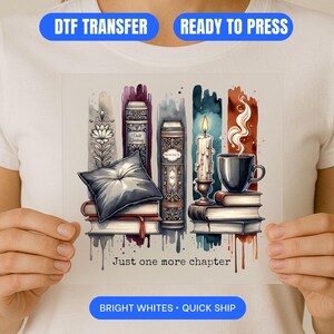 May include: DTF transfer featuring a watercolor design of books, a candle, a cup of coffee, and a pillow. The text "Just one more chapter" is below the image. The transfer is ready to press and has bright whites.