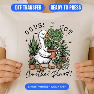 May include: A white graphic featuring a cartoon goose holding a potted plant, surrounded by other potted plants. The text reads "OOPS! I GOT Another Plant!" in a whimsical font. The image is on a white background.