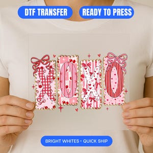May include: A DTF transfer with the letters "XOXO" in pink and red, decorated with bows, hearts, and cherries. The words "DTF TRANSFER" and "READY TO PRESS" are in blue banners. The words "BRIGHT WHITES • QUICK SHIP" are in a blue banner.