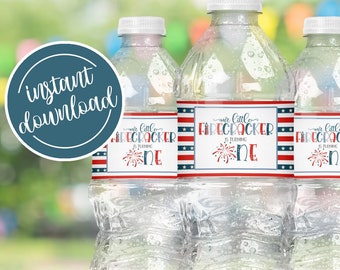 May include: Three clear plastic water bottles with red, white and blue labels that say "We Celebrate Firecracker One". The labels have a red, white and blue striped background with a firework graphic.