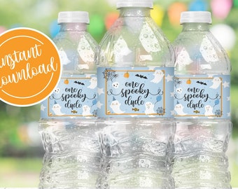 May include: Three clear plastic water bottles with blue and white labels that say "one spooky dude" with a ghost and bat graphic.