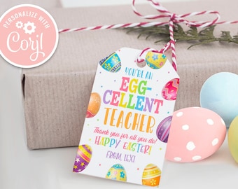 Peut inclure: Une étiquette cadeau de Pâques colorée avec le texte "You're an Egg-Cellent Teacher" et un motif d'œuf coloré. L'étiquette comprend également le texte "Thank you for all you do! Happy Easter! From, Lexi".