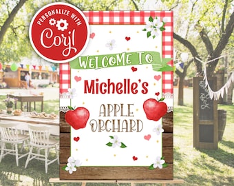 Op de afbeelding: Een printbaar bord voor een appelboomgaardfeest. Het bord is wit met rode en groene accenten. Het staat "Welkom bij Michelle's appelboomgaard".
