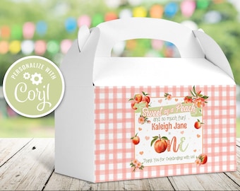 May include: A white favour box with a pink and white gingham pattern. The box has a peach design with the text "Sweet as a Peach and so much fun! Kaleigh Jane is One. Thank You for Celebrating with us!"