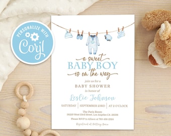 May include: A blue and brown baby shower invitation with a watercolor illustration of baby clothes hanging on a clothesline. The text reads "a sweet baby boy is on the way".