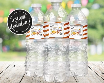 May include: Three clear plastic water bottles with orange and black Halloween-themed labels that say "Happy Hallo One".