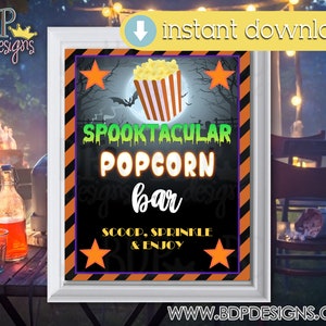 May include: Printable Halloween party sign with black and orange stripes, a spooky moon, and a bat. The sign says "Spooktacular Popcorn Bar" with a bucket of popcorn and stars. It also says "Scoop, Sprinkle & Enjoy".