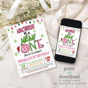May include: A printable invitation for a first birthday party. The invitation features a pink and green "Mean One" graphic with a Santa hat and a Christmas ornament. The text reads "Michelle is a Mean One. Join us to celebrate Michelle's 1st Birthday. Saturday, December 21st, 2:00 PM. The Jenkins Home, 8995 Willow Trace, Richmond, VA 23659. RSVP to Lisa Jenkins at (598) 759-9554 or jenkins@ymail.com. Line for additional info if needed."