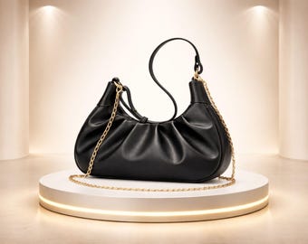 Elegante bolso de hombro de piel sintética negra con correa de cadena: diseño elegante y con estilo.