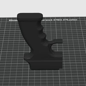 May include: A black, 3D-printed handle with a contoured grip and a rectangular top. The handle features finger grooves for a secure hold and a curved design. The object is set against a grid background.