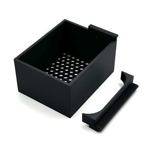 May include: A matte black rectangular storage container with a perforated honeycomb base and a separate matching black handle piece featuring a curved cutout, designed for modular assembly or attachment to the main box structure.