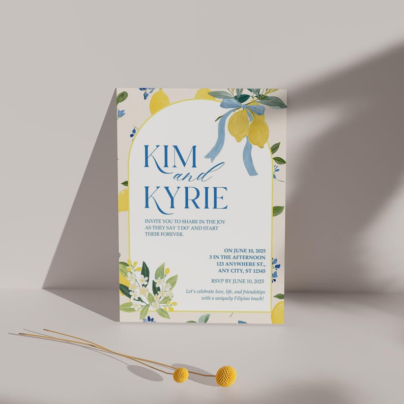 May include: A wedding invitation with a lemon theme. The invitation features the names "Kim and Kyrie" in blue script, with text that reads "Invite you to share in the joy as they say I do and start their forever." The invitation includes the date, time, and location.