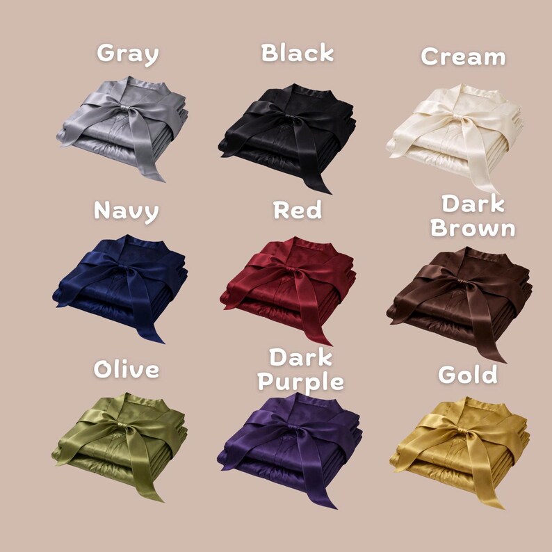 May include: Nine sets of folded satin pajamas in various colors, each tied with a matching satin ribbon. Colors include gray, black, cream, navy, red, dark brown, olive, dark purple, and gold. The pajamas are neatly stacked.