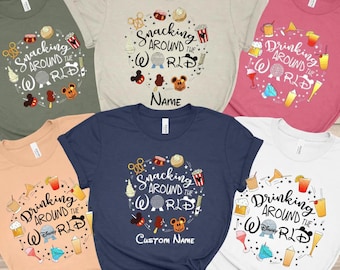 May include: Assorted t-shirts in various colors, featuring the phrases "Snacking Around the World" and "Drinking Around the World." Each shirt has a circular design with food and drink illustrations, and Disney-themed icons. Some shirts have a space for a custom name.