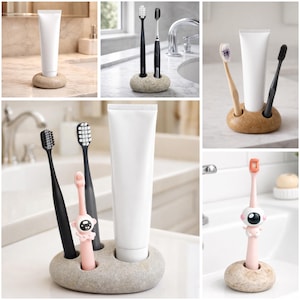 May include: A collection of toothbrush holders, each with a unique design. The holders are made of stone and wood, and hold toothbrushes and toothpaste tubes. The toothbrushes come in various colors, including black, pink, and white.