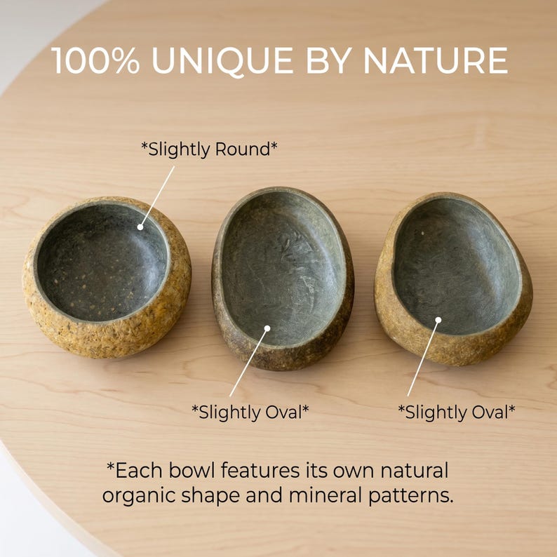 May include: Three stone bowls with unique shapes and mineral patterns. The bowls are in shades of brown and gray, with the text "100% UNIQUE BY NATURE" at the top. The bowls are labeled "Slightly Round" and "Slightly Oval".