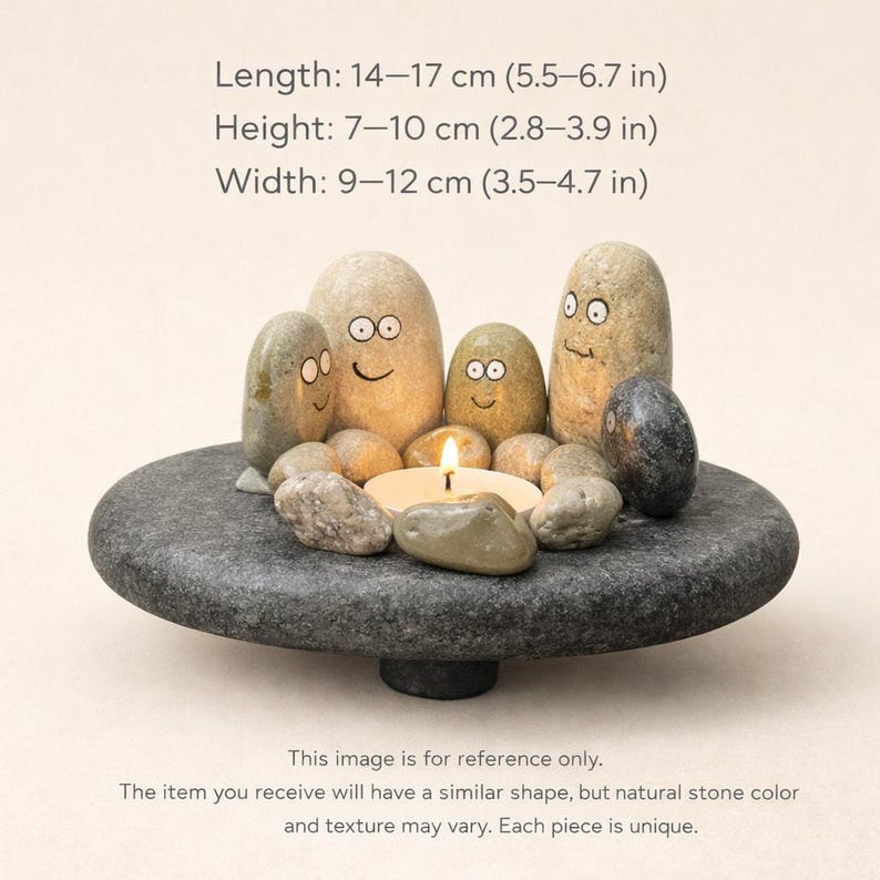 May include: A stone candle holder with a gray, round base and a collection of smooth, painted stones. The stones have faces and surround a lit candle. The length is 5.5-6.7 inches, height is 2.8-3.9 inches, and width is 3.5-4.7 inches.