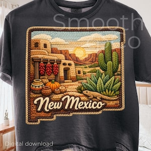 May include: Dark gray t-shirt featuring a colorful Southwestern design. The graphic includes a desert landscape with buildings, cacti, and the text "New Mexico". The design is framed with a textured border.
