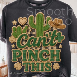 May include: Dark gray t-shirt with a graphic design featuring a cactus, heart, and cowboy hat. The text "Can't Pinch This" is in green plaid lettering, with shamrocks and stars. The words "Digital download" are at the bottom.