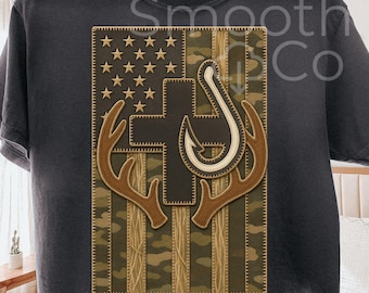 May include: Dark gray t-shirt featuring a patriotic design. The design includes an American flag with a cross, fishing hook, and deer antlers. The words "Digital download" are at the bottom.