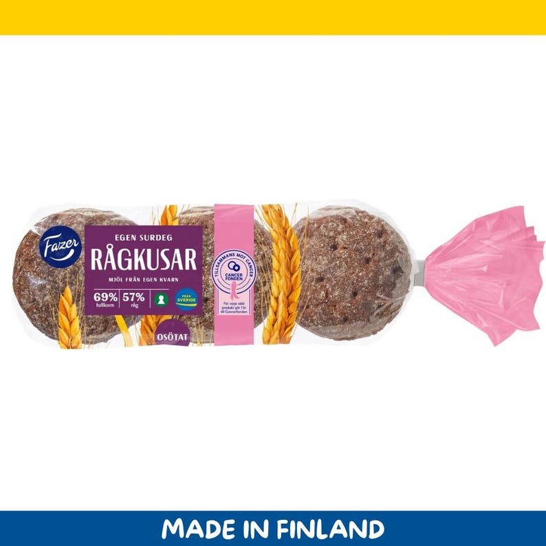May include: A package of round rye bread rolls. The bread is dark brown and wrapped in clear plastic. A pink label and a pink twist tie are visible. The package has text in Swedish and the words "MADE IN FINLAND".