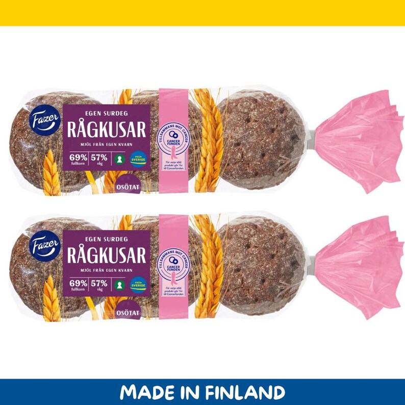 May include: Two packages of round rye bread rolls, each wrapped in clear plastic and tied with pink ribbon. The packaging features text in Swedish, including "R&aring;gkusar" and "Egen Surdeg", with wheat stalks and a pink ribbon symbol.