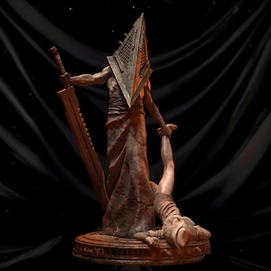 May include: A detailed statue of a figure with a pyramid-shaped head, holding a large sword and a person. The statue is primarily brown with a textured appearance, set against a dark background.