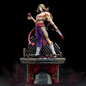 May include: A detailed figurine of a muscular character with long blonde hair, a white mask, and purple pants with gold accents. The figure holds a rose and a bladed weapon, standing on a platform with roses and red curtains.