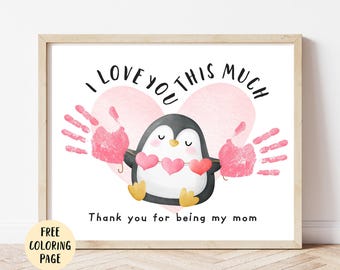 May include: A framed print featuring a watercolor illustration of a penguin holding three pink hearts. The text reads "I love you this much" and "Thank you for being my mom." Includes a "FREE COLORING PAGE" graphic.