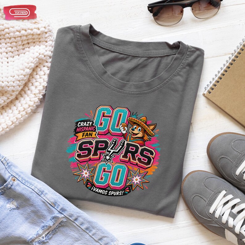 Colorful retro-style San Antonio Spurs basketball graphic featuring a coyote mascot wearing a sombrero, with bold 3D text reading Crazy Hispanic Fan, Go Spurs Go, and ¡Vamos Spurs! in neon pink, teal, and orange on a black background.