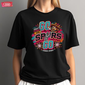 Colorful retro-style San Antonio Spurs basketball graphic featuring a coyote mascot wearing a sombrero, with bold 3D text reading Crazy Hispanic Fan, Go Spurs Go, and ¡Vamos Spurs! in neon pink, teal, and orange on a black background.