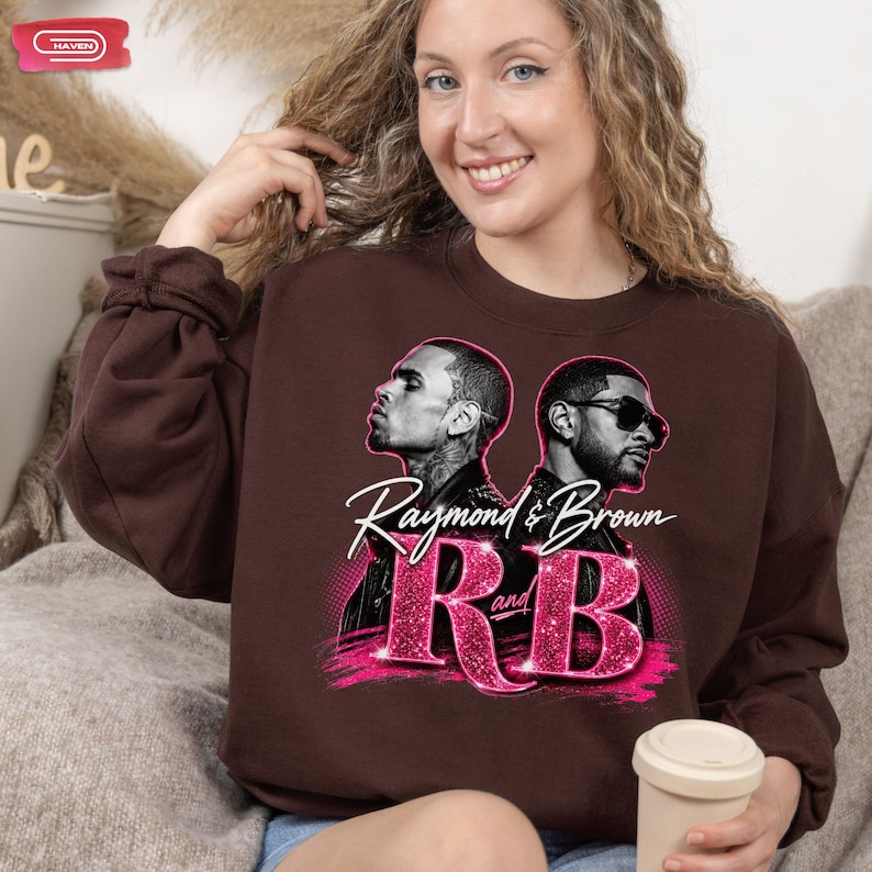 A promotional graphic featuring singers Chris Brown and Usher back-to-back, with the text "Raymond & Brown R and B" in sparkly pink and white lettering against a dark geometric background.