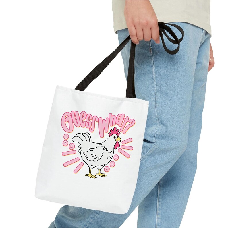 Lifestyle mockup of a preppy girl wearing a white oversized t-shirt featuring the funny pink Guess What Chicken Butt matching front and back sublimation designs.