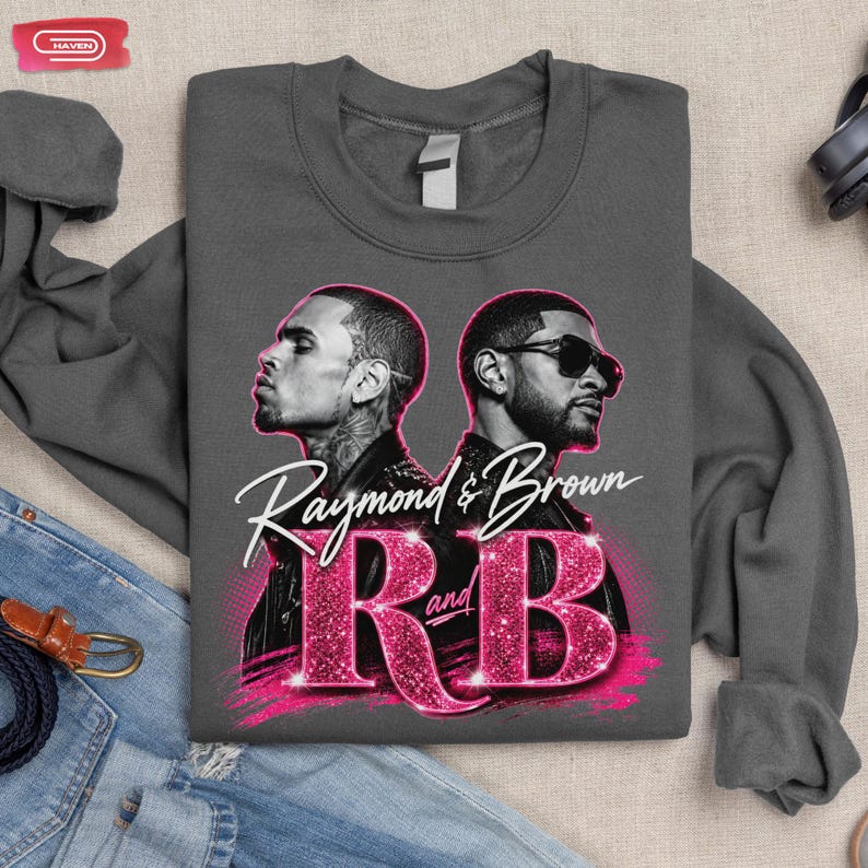 A promotional graphic featuring singers Chris Brown and Usher back-to-back, with the text "Raymond & Brown R and B" in sparkly pink and white lettering against a dark geometric background.