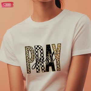 Bold "PRAY" text with leopard, checkerboard, and starry patterns, overlaid with a cursive "just" script, featuring a gold outline.