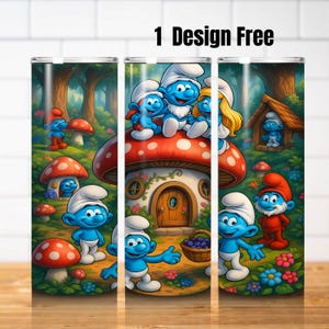 May include: A tumbler featuring a whimsical design with Smurfs characters in a forest setting. The design includes mushroom houses, flowers, and the text "1 Design Free". The tumbler is cylindrical and likely made of stainless steel.
